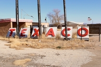 Near El paso stop by a oh almost ghost town Walk around and found this Texaco sign