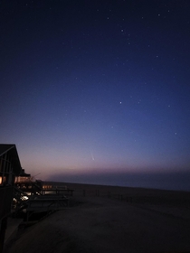 Neowise Comet seen before a beach sunrise 