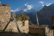 Nepalese Village with the Annapurna Range in the Background 