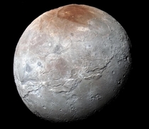 New Horizons captured this high-resolution enhanced-color view of Plutos moon Charon The image combines blue red and infrared images processed to best highlight the variation of surface properties most striking is the reddish north top polar region inform
