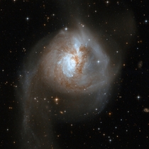 NGC  - the relict of a collision of two separate galaxies that took place in a distant past 