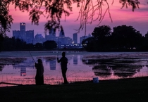 OC Detroit skyline reflected in Lake Muskoday on Belle Isle after sunset
