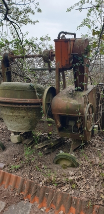 Old cement mixer near the woods