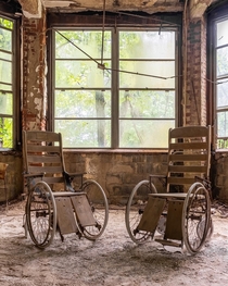 Old patient wheelchairs in an abandoned TB hospital