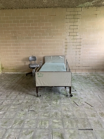 One lone bed left in abandoned asylum