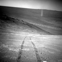 Opportunitys tracks on Mars surface and a martian dust devil 