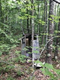 Outdated outhouse out and about in the Maine woods