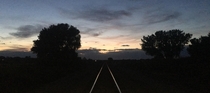 Perfectly straight tracks for miles Every night I get to run past this spot Today I had to stop and enjoy the perfect sunset  Near Wyoming  Montana State line outside of Cowley 