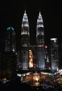 Petronas Towers with Suria KLCC shopping mall in front - Kuala Lumpur Malaysia 