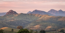 Pink dawn light cast upon the mountains of the Scenic Rim South East Queensland  x OC