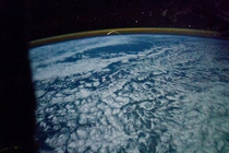 Plasma trail from Space Shuttle Atlantiss re-entry Photographed from the ISS 