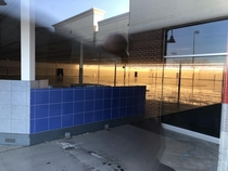 Please excuse the glare but this is an abandoned Kmart that I loved shopping at it was built on top of a demolished mall Both are missed