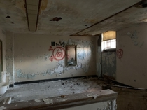 Psychiatric hospital surgery room with satanic graffiti