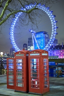 Red telephone box and The London Eye in the Background - London 