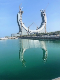 Reflection on the sea of the katara towers lusail Qatar still unfinished