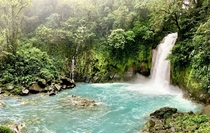 Rio Celeste Waterfall Costa Rica ensconced in cloud forest greeneries  x