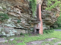 Ruins of a small house nestled against the cliffs in Southern Illinois