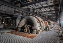 Rusting turbines inside an abandoned Navy facility