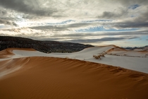 Sand dunes at sunrise after the first snow of the season Coral Pink Sand Dunes State Park Utah 