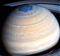 Saturn with hexagonal storm clouds