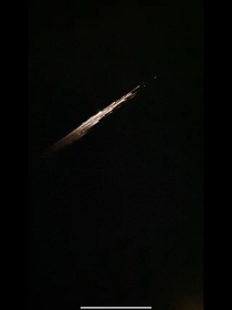 Saw this in person right after coming out of Target I took this photo out of an iPhone  video so its not very high quality I still wanted to share it because it was beautiful and profound to see Apparently it was a piece of falcon  debris