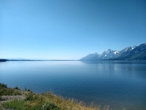 Side view of the Grand Tetons from across Jackson Lake in Wyoming USA 