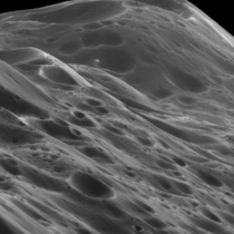 Six mile high mountains on Iapetus one of Saturns moons