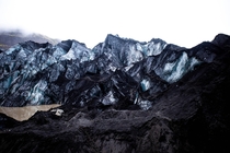 Slheimajkull glacier covered in black ashe 