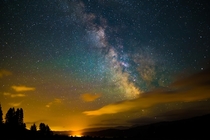Small town lights bleeding into the Milky Way in a sleepy pocket of dark sky in the Cascades  x