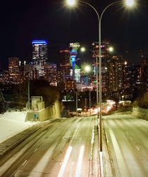 Snowy Calgary with Aurora display on the Telus building