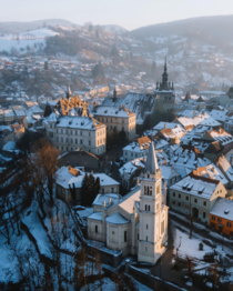 Soft evening light shines on the medieval city of Sighisoara Romania