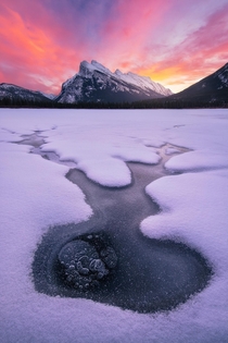 Some interesting ice on Vermilion Lakes leads to Mount Rundle near Banff Alberta 