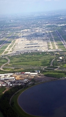 Sorry for the potato quality Londons Heathrow International Airport with the M in the foreground 