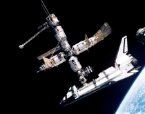Space shuttle Atlantis docked to the Mir Space Station  July 