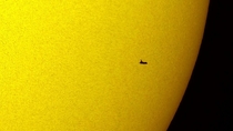 Space Shuttle Atlantis transiting the sun on its way to the Hubble Telescope