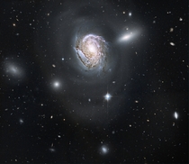 Spiral galaxy NGC  in the Coma Cluster 