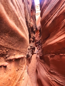 Squeezing through spooky canyon - Grand Staircase-Escalante National Monument UT US 