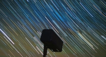 Star trails over a mailbox 