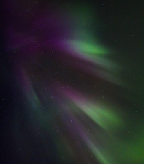 Stars and streaky Aurora Borealis in Iceland 