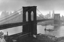 Storm clouds hover over the Brooklyn Bridge and the ghostly skyscrapers of Manhattans financial district in March  