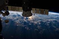 Storm clouds over the Atlantic Ocean near Brazil and the Equator on July   with a Russian capsule in the foreground 