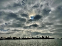 Sun just peeking through a hole in the morning marine layer - Taken from my kayak in a So Cal bay