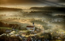 Sun setting over misty Smlednik Slovenia 