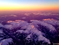 Sunrise light hitting the tops of the Austrian Alps 
