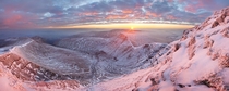 Sunrise over a snow-covered Pen y Fan - the highest peak in Brecon Beacons National Park South Wales  by Alexander Nail