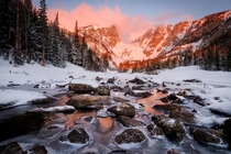Sunrise over the partially frozen outlet of Dream Lake  ft in Rocky Mountain National Park OC 