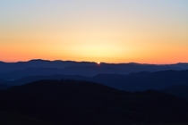Sunrise peaking over the Blue Ridge Mountains Max Patch NC 