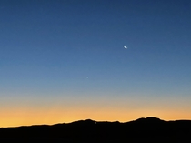 Sunrise with moon and tiny Venus Merzouga Morocco