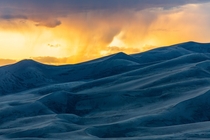 Sunset and rain in Great Sand Dunes National Park Colorado USA 