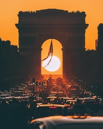 Sunset behind Arc de Triomphe Paris